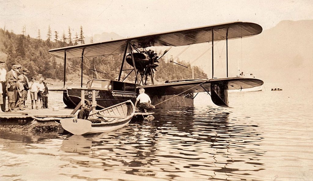 Old fashion biplane on floats at a dock in Mannion Bay